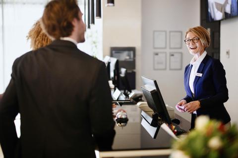 Guests getting checked in with front desk software